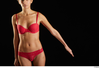 Waja   1 arm flexing front view red bra…